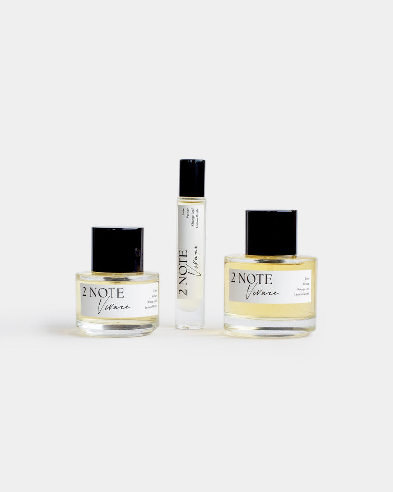 Vivace botanical fragrance in three sizes — small and large spray bottles and a roller, pale yellow oil through clear glass