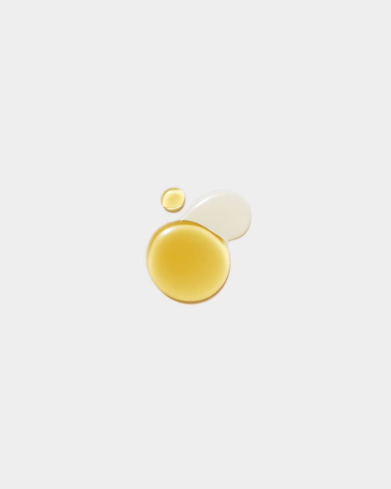 Body Duo Set formula swatches — golden yellow oil drop and small cream swatch on light gray, botanical natural skincare body textures