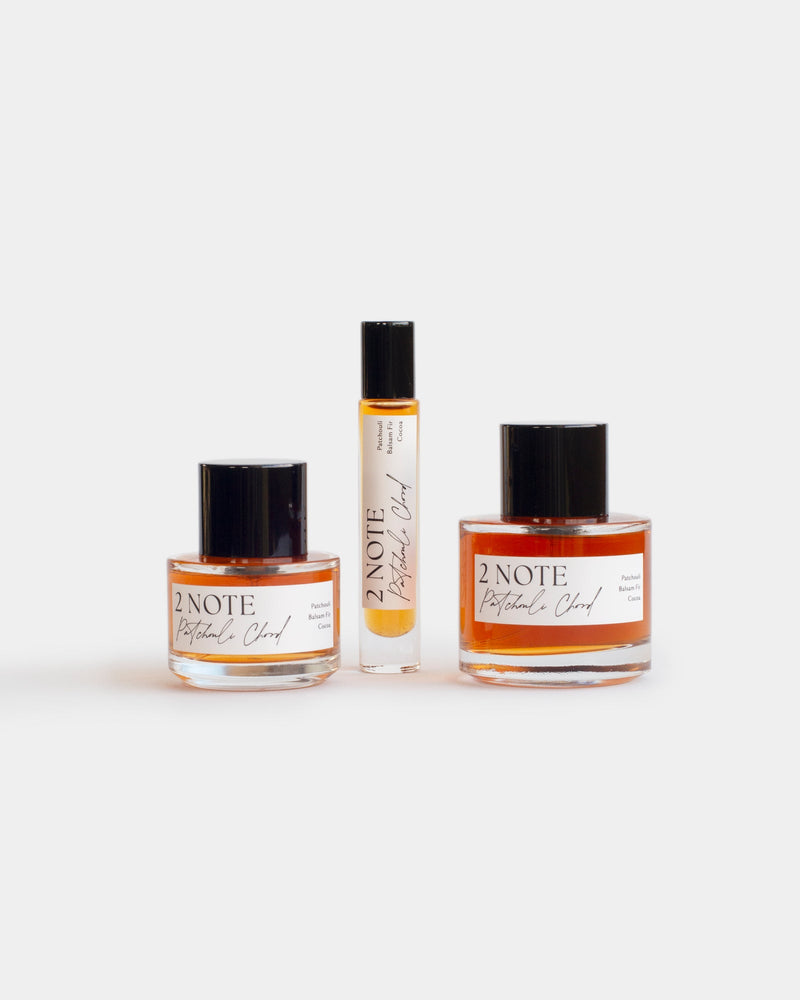 Patchouli Chord botanical fragrance in three sizes — small and large spray bottles and a roller, terracotta oil through clear glass