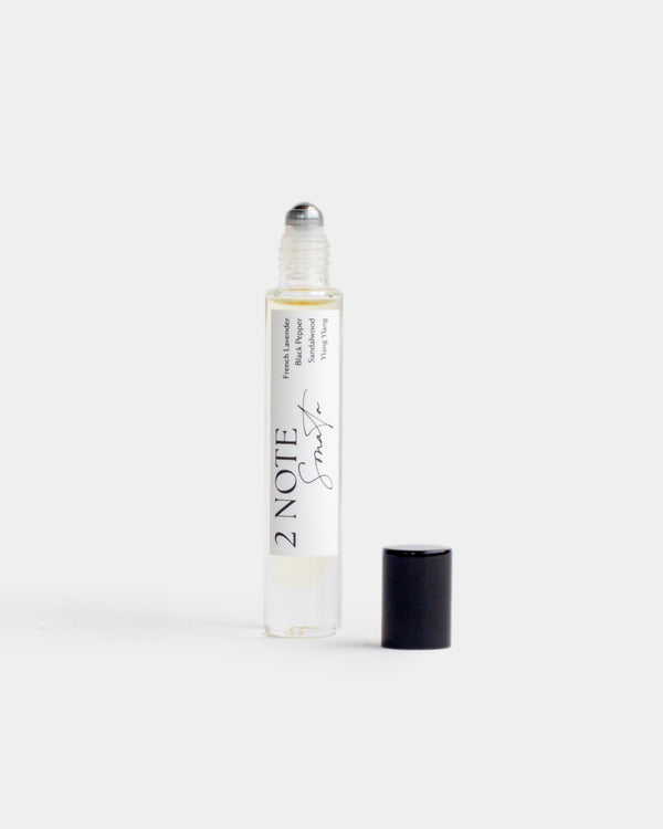 Sonata in tall clear glass roller bottle — botanical fragrance oil, pale yellow, uncapped