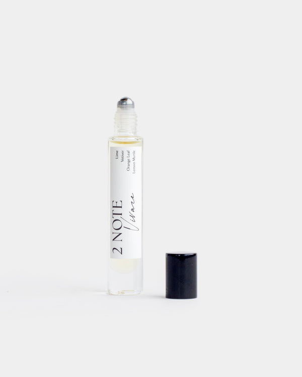 Vivace in tall clear glass roller bottle — botanical fragrance oil, pale yellow, uncapped