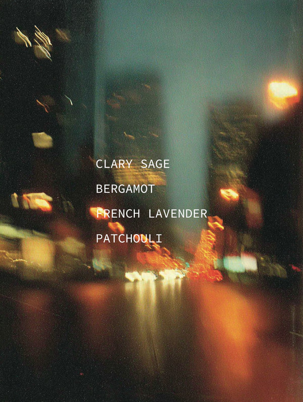 Blurred night city street with traffic light trails — mood portrait for Legato botanical fragrance with Clary Sage, Bergamot, French Lavender, and Patchouli