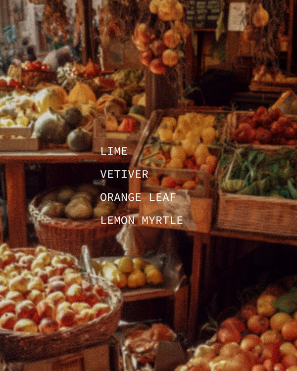 Colorful outdoor fruit and citrus market stall — mood portrait for Vivace botanical fragrance with Lime, Vetiver, Orange Leaf, and Lemon Myrtle